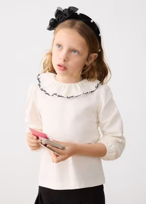 blusa con colletto volant